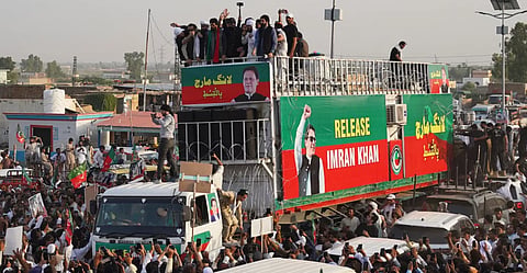 Supporters of imprisoned former Prime Minister Imran Khan's party prepare to march demanding Khan's release, in Lakki Marwat, a remote town in northwestern Pakistan, Sunday, Oct. 4, 2026. 