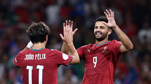 Portugal's Goncalo Ramos (R).
