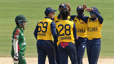 Sri Lanka U-19 women's team cricketers celebrate a wicket during their T20I against Pakistan in Faisalabad on Monday.