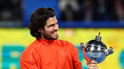 Spain's Carlos Alcaraz celebrates with the trophy after winning the final against Czech Republic's Jiri Lehecka.