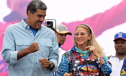 Venezuela's President Nicolas Maduro and his wife Cilia Flores greet supporters during his closing campaign rally in Caracas, Venezuela May 17, 2018.