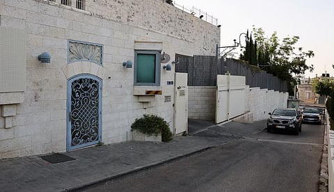 Vehicles approach the British consulate with signage removed near the entrance, on the deadline set by Israel for its closure, following trade sanctions imposed by British Prime Minister Andy Burnham on Israeli settlements in the occupied West Bank, in East Jerusalem, October 8, 2026.