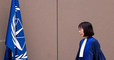Judge Tomoko Akane walks before delivering the verdict in the Al Hassan case at the International Criminal Court in The Hague, Netherlands, Wednesday Nov. 20, 2024. 
