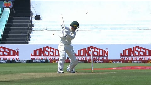Australia's Nic Maddinson looks on as the ball smashes into the stumps.