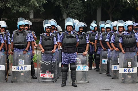 Members of the Rapid Action Force (RAF) stand guard ahead of a protest planned by the Cockroach Janta Party (CJP) seeking the resignation of India's Chief Election Commissioner Gyanesh Kumar, near the protest site in New Delhi, India, October 10, 2026.