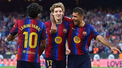 FC Barcelona's Anthony Gordon celebrates scoring their first goal with Rodri and Lamine Yamal.