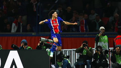 Paris St Germain's Maghnes Akliouche celebrates scoring their third goal.