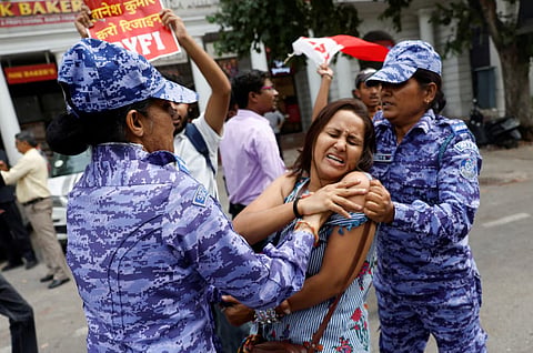 (Representational Image) A protester is detained by security personnel during a protest by the Cockroach Janta Party (CJP) seeking the resignation of India's Chief Election Commissioner Gyanesh Kumar, near the protest site in New Delhi, India, October 11, 2026.