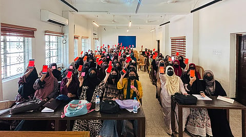 DU students show red cards over teacher’s remarks about veiled student