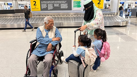 Professor Yunus met his young fans at JFK Airport shortly before Awami League activists verbally attacked him.
