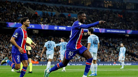 Paris St Germain's Ousmane Dembele celebrates scoring their second goal with Achraf Hakimi.