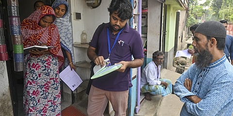 A booth level officer (BLOs) during house-to-house verification of voters as the Special Intensive Revision (SIR) of electoral rolls.
