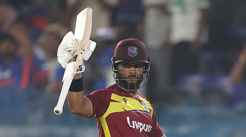 Shai Hope celebrates his second T20I century in the series.