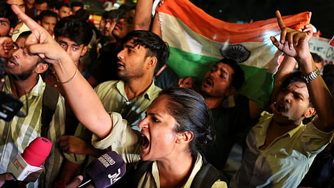 Protesters chant slogans as they take part in a flag rally by the Cockroach Janta Party (CJP) seeking the resignation of India's Chief Election Commissioner Gyanesh Kumar, in New Delhi, India, October 16, 2026.