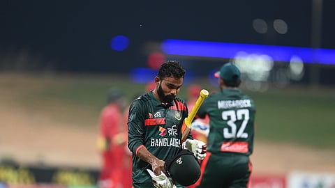 Bangladesh series captain Towhid Hridoy walks back to the pavilion after being dismissed during the tri-nation series opener against Zimbabwe.