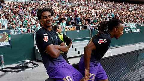 FC Barcelona's Lamine Yamal celebrates scoring their first goal with Jules Kounde.