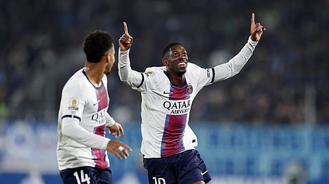 Paris St Germain's Ousmane Dembele celebrates scoring their second goal with Desire Doue.