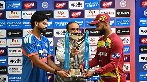 Shreyas Iyer and Shai Hope pose with the trophy after their teams shared the series.