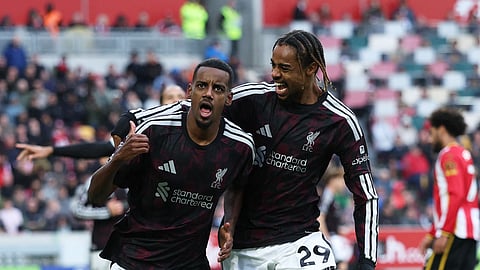 Liverpool's Alexander Isak celebrates scoring their second goal with Bradley Barcola.