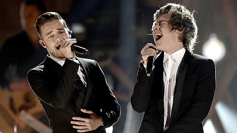 Liam Payne (left) and Harry Styles of One Direction perform onstage during the 2013 American Music Awards on 24 November, 2013 in Los Angeles, US.
