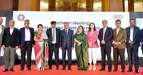 Finance Minister Amir Khosru Mahmud Chowdhury and other officials pose for a photograph at the event.