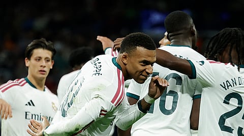 Real Madrid's Kylian Mbappe celebrates scoring their third goal.