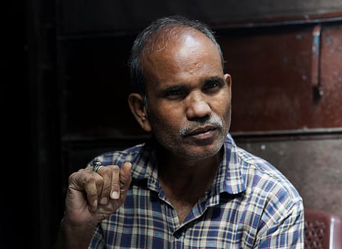 Kamta Prasad, 53, a voter who is listed as "Kanta Prasad" and is declared dead in the Special Intensive Revision (SIR) list published on August 1, 2026, gestures during Reuters interview in New Delhi, India, October 15, 2026.