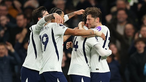 Tottenham Hotspur's Ben Davies celebrates scoring their third goal with teammates.