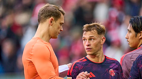 Bayern Munich's Manuel Neuer (L) and Joshua Kimmich.