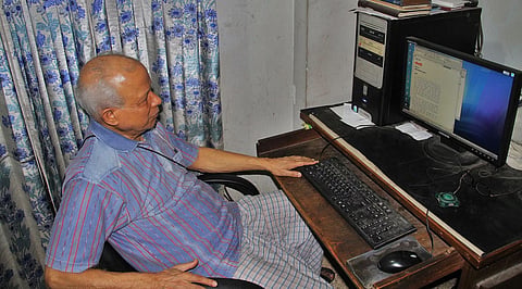 Kazi Anwar Hossain at his writing desk