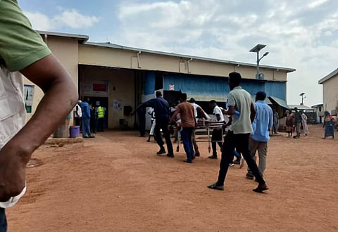 A person wounded in a drone strike on a market in the disputed Abyei region along the border between South Sudan and Sudan is carried to Ameth Bek hospital, October 19, 2026. 