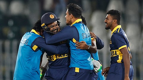Sri Lanka’s Janith Liyanage celebrates with teammates after hitting the winning six against England in the third ODI in Rawalpindi, Pakistan, on 22 October 2026.