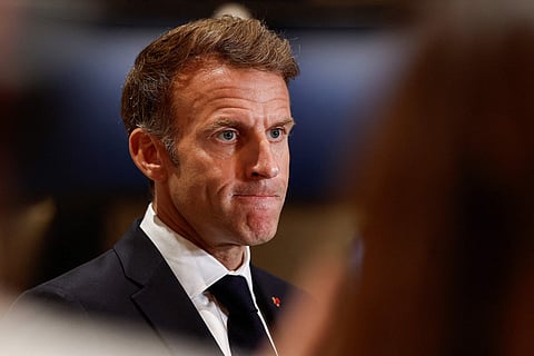 France's President Emmanuel Macron speaks to members of the media in Lusail, Qatar, Oct 21, 2026. 