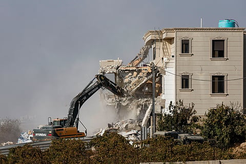 Israeli machinery demolishes a Palestinian house following a shooting attack, in Hebron in the Israeli-occupied West Bank, October 23, 2026.