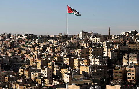A Jordanian flag flies over the capital city, Amman, Jordan August 17, 2025.