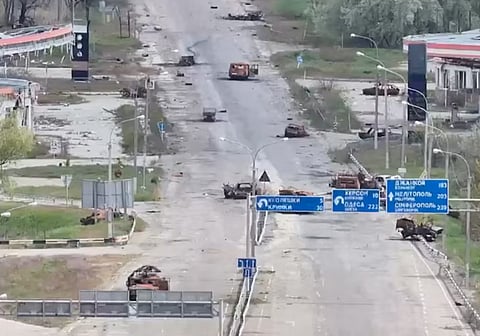 A still image taken from an undated drone video released September 24, 2026, shows destroyed vehicles sitting on a street in Oleshky, Kherson Region, Russian-controlled Ukraine. 