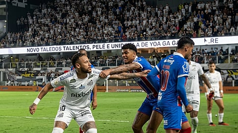 Neymar Junior (L) reacts after getting red carded.