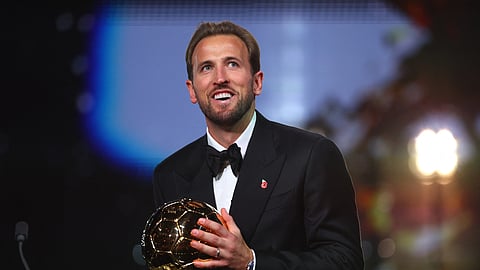 Harry Kane celebrates after winning the men's Ballon d'Or award.