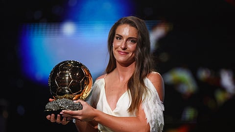 Alexia Putellas celebrates after winning the women's Ballon d'Or award.