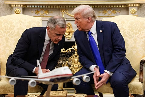 US President Donald Trump meets with Canada's Prime Minister Mark Carney in the Oval Office at the White House in Washington, D.C., US, October 7, 2025. 