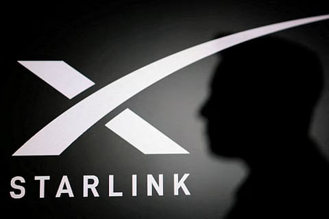 The silhouette of Elon Musk and Starlink logo are seen in this illustration taken June 11, 2026.