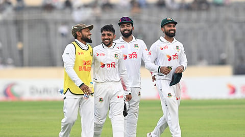 The opening day had also been cut short by bad light, which left Shadman Islam (R) waiting on 99 not out.