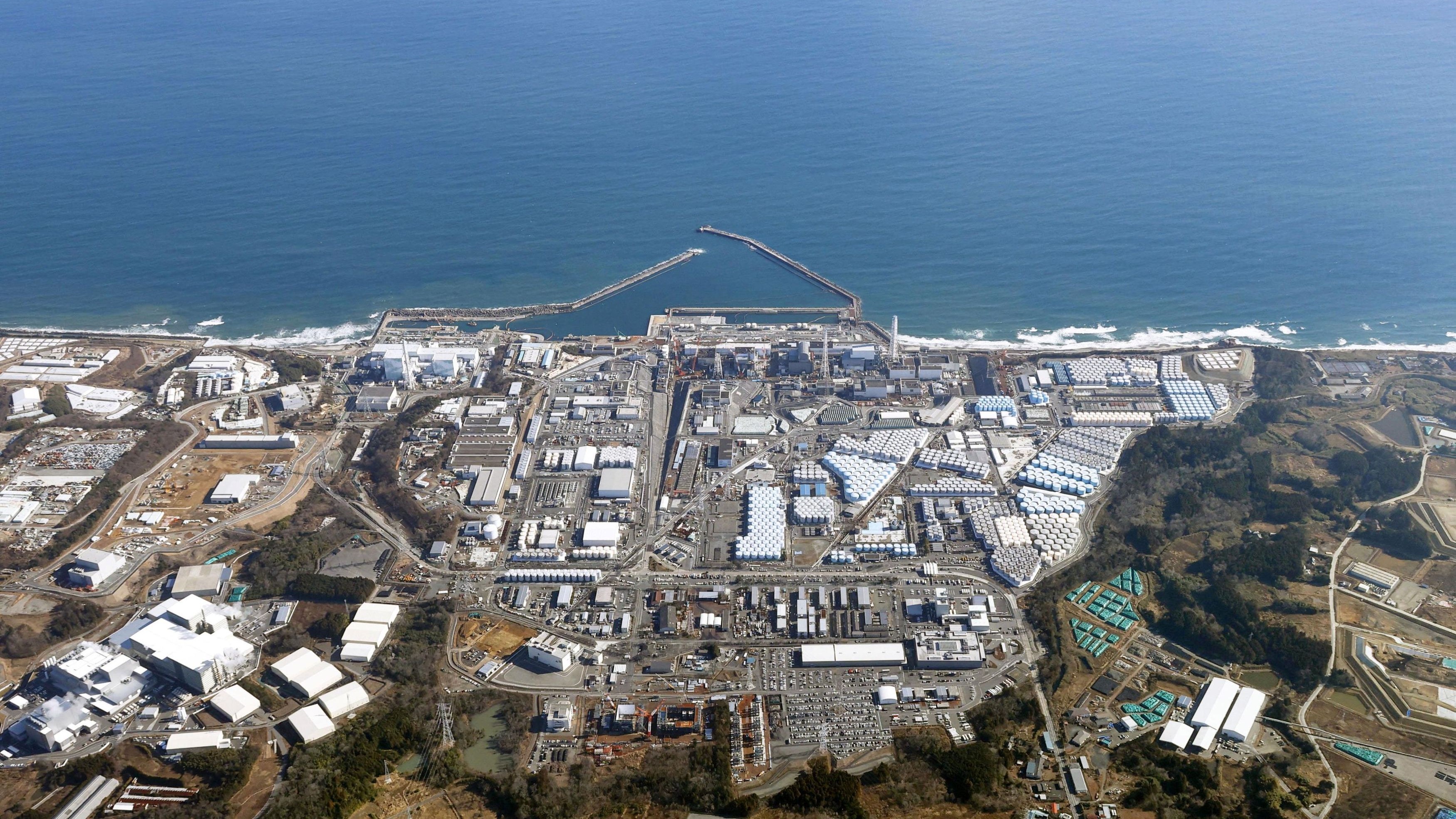 An aerial view shows the storage tanks for treated water at the tsunami-crippled Fukushima Daiichi nuclear power plant in Okuma town, Fukushima prefecture, Japan August 22, 2023, in this photo taken by Kyodo.