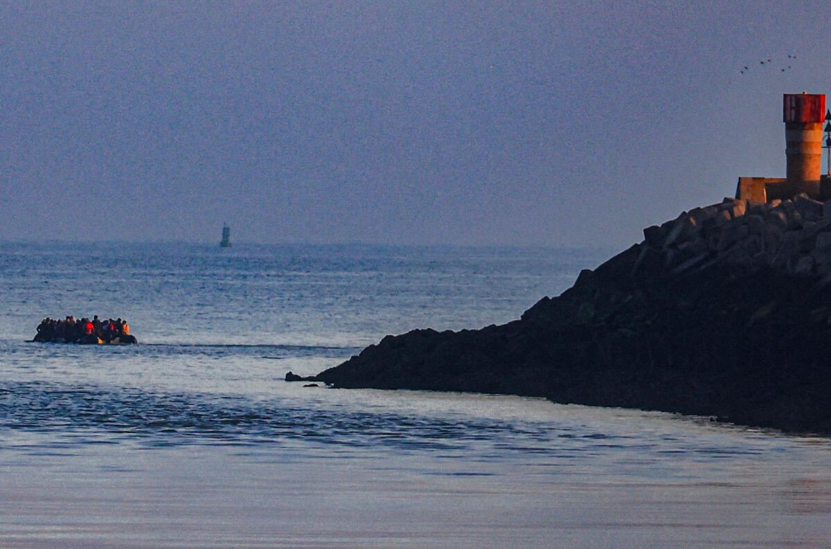 Dozens of migrants leave the port of Grand-Fort-Philippe to cross the Channel to the UK on a small boat, in Grand-Fort-Philippe near Calais, France.