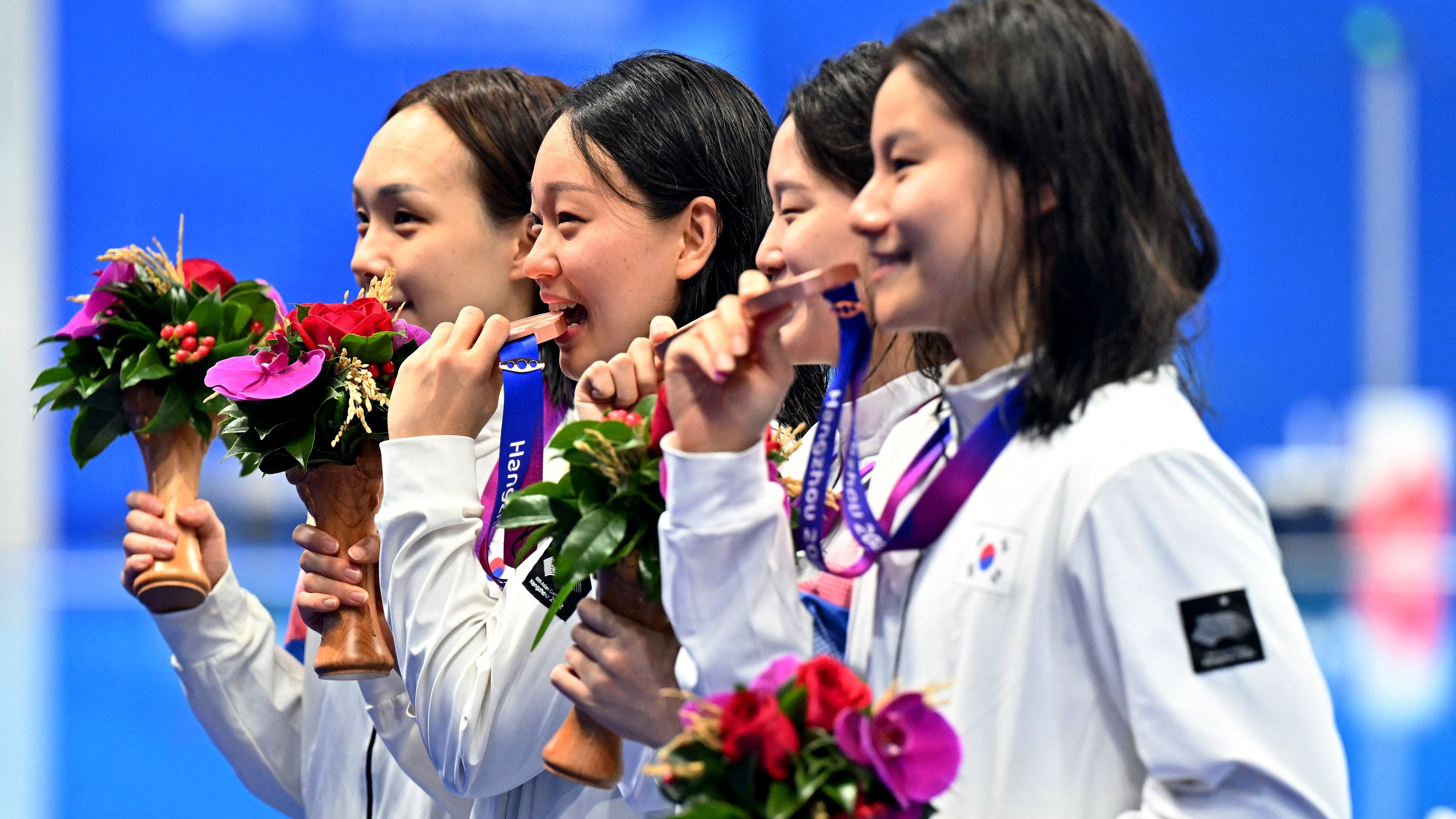Bronze medallists South Korea's Kim Seoyeong, Hur Yeonkyung, Park Sujin and Han Dakyung pose during the medal ceremony for the Women's 4X200m Freestyle Relay. 