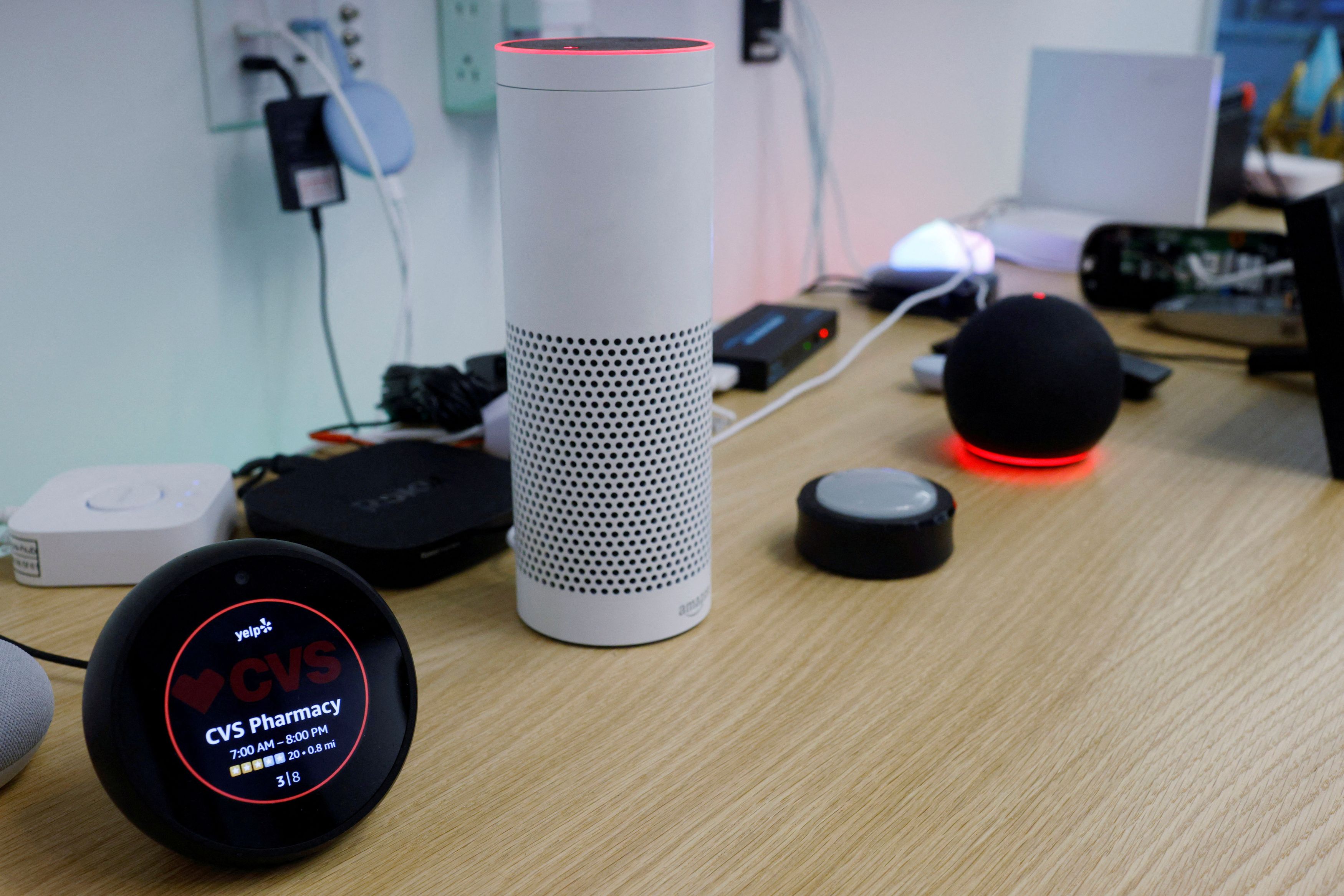 An Amazon Echo Spot, an Amazon Echo Plus 1st Generation, an Amazon Echo Button and an Amazon Echo Dot 4th Generation.