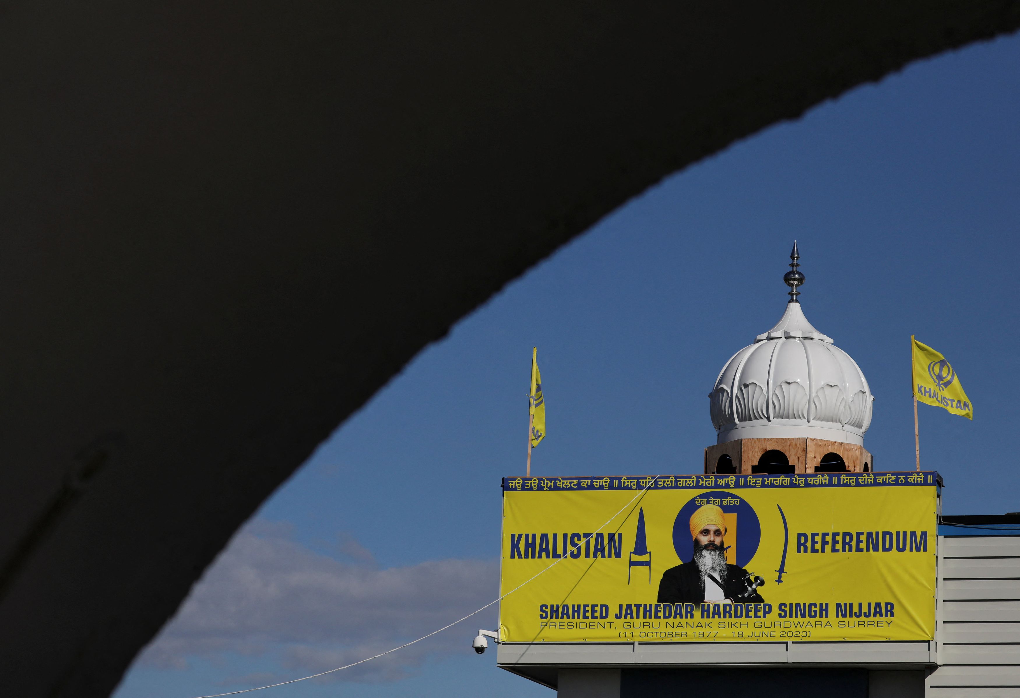 A banner with the image of Sikh leader Hardeep Singh Nijjar is seen at the Guru Nanak Sikh Gurdwara temple, site of his June 2023 killing, in Surrey, British Columbia, Canada September 20, 2023.