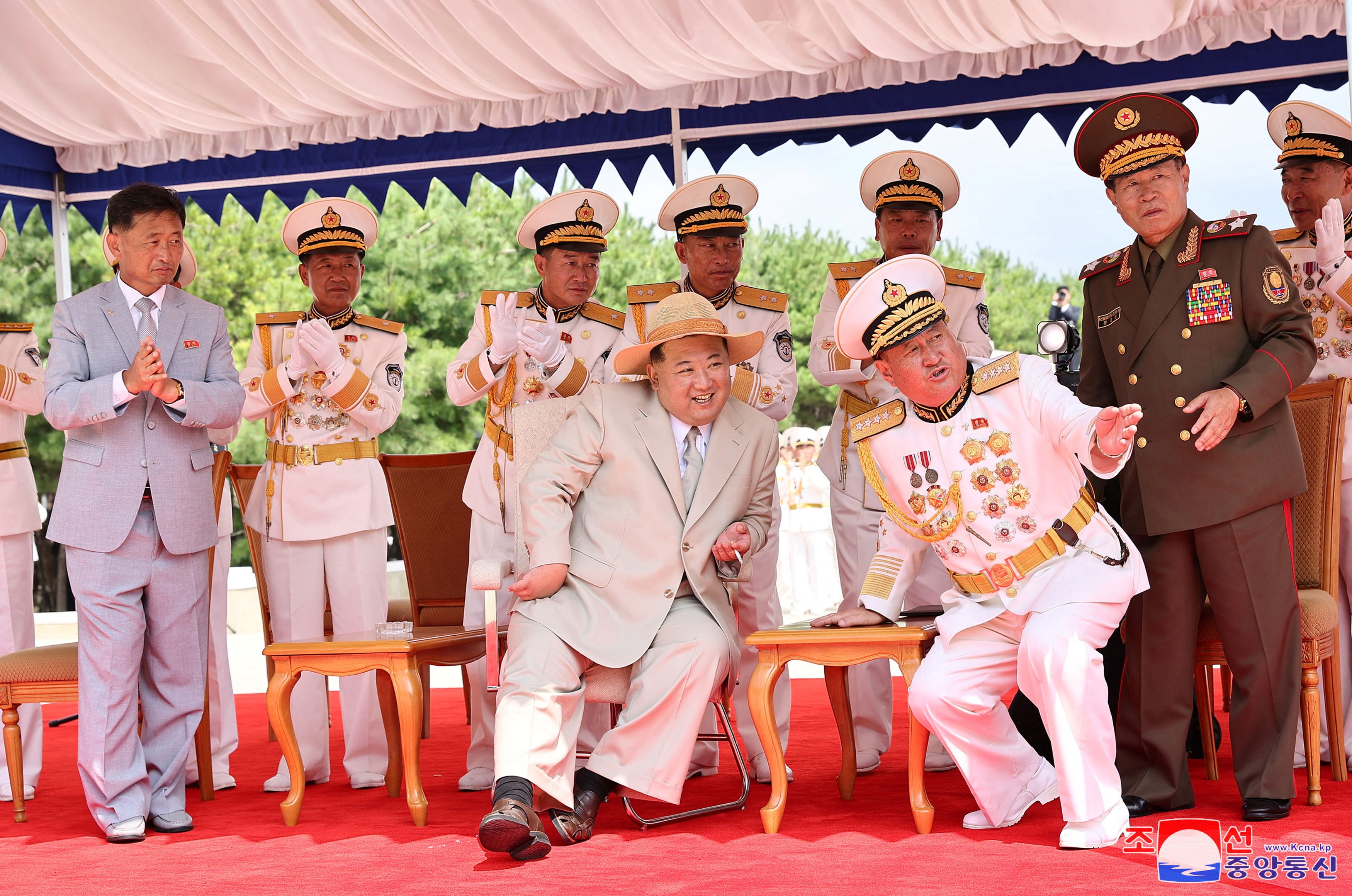 North Korean leader Kim Jong Un attends what state media report was a launching ceremony for a new tactical nuclear attack submarine in North Korea.
