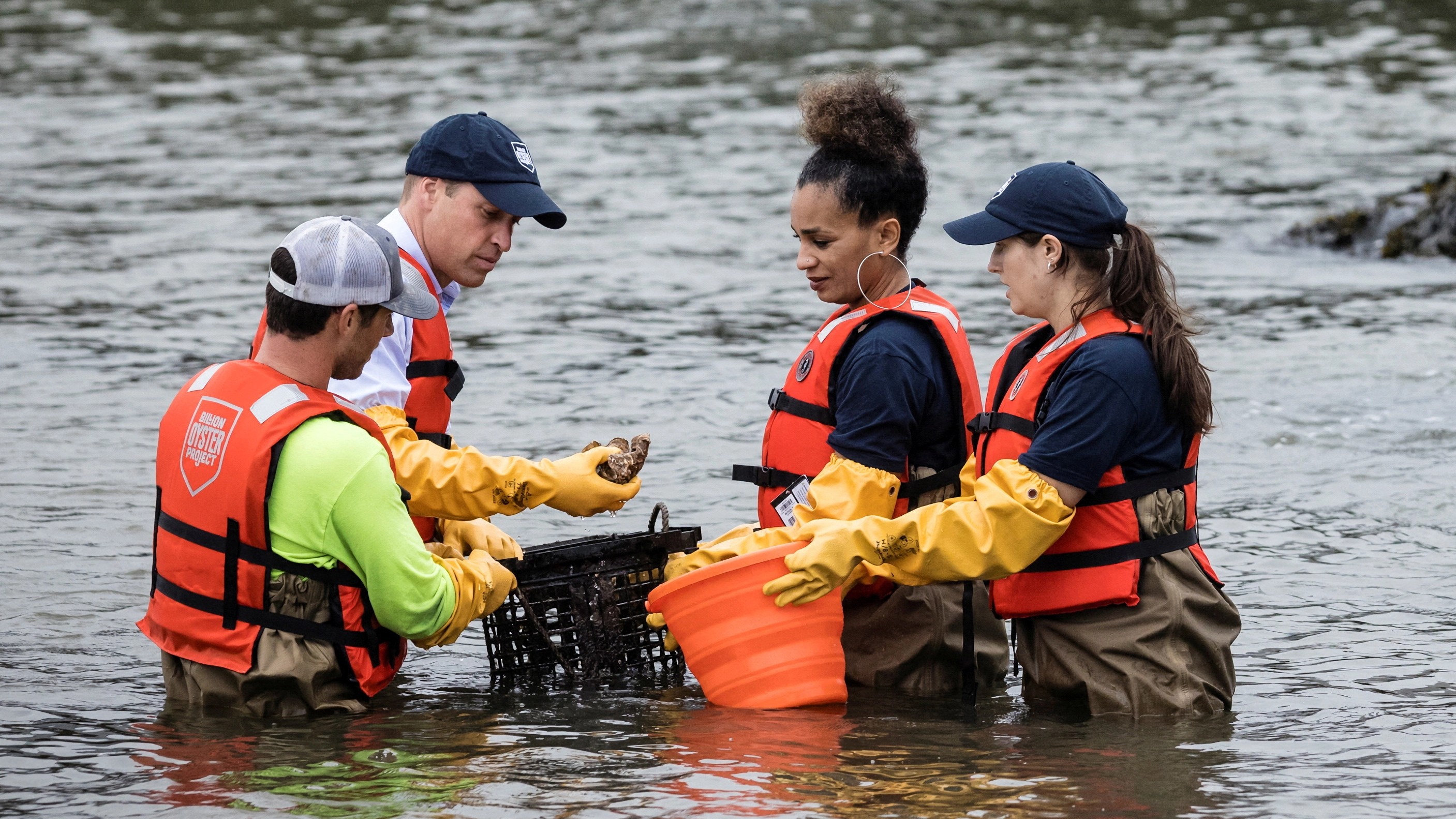 Britain's Prince William, Prince of Wales examines oyster samples in the East River with students from the Urban Assembly New York Harbor School about the Billion Oyster Project in Brooklyn, New York on Monday Sept. 18, 2023.