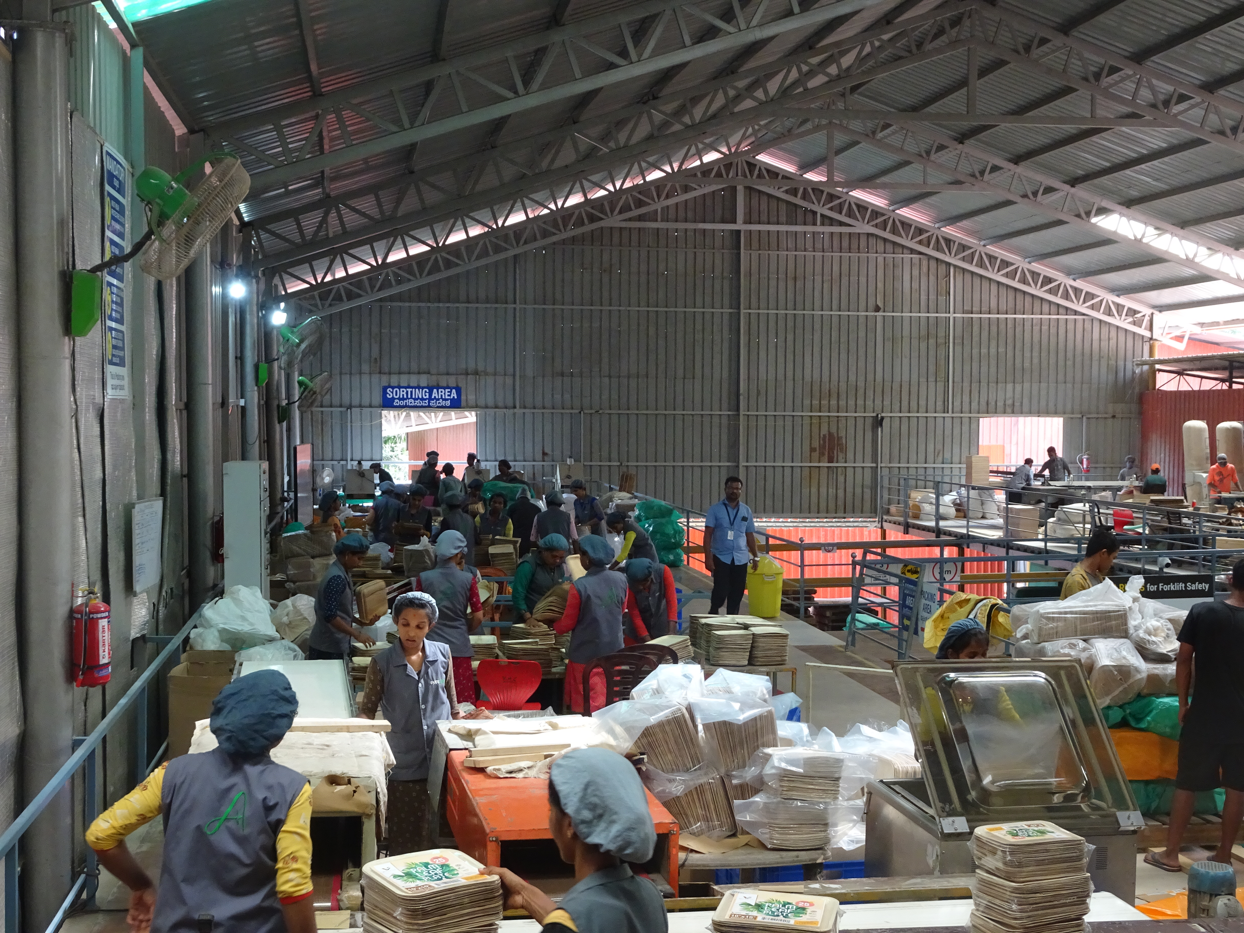 Areca plates being sorted and packed by employees at the Agrileaf Exports facility in Nidle near Dharmasthala.